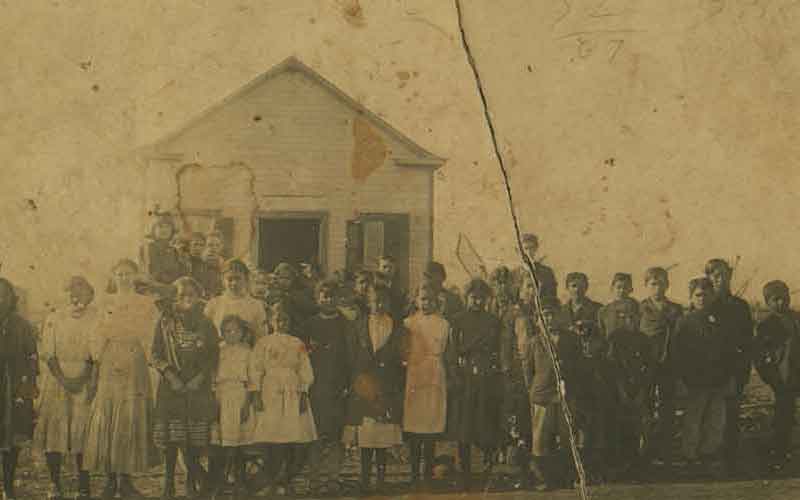 Class photo of El Carmen School children and Teacher located south of San Antonio, Texas (early 1900s)